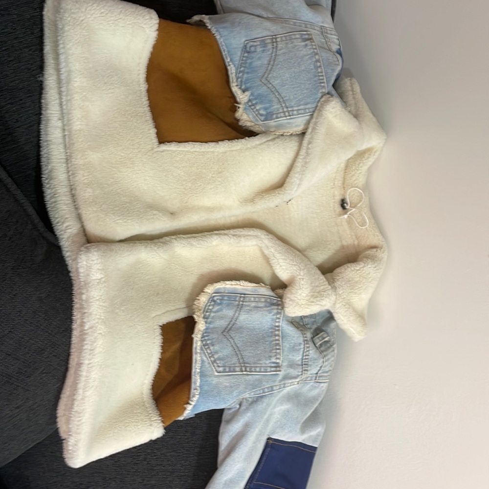 Multi colored jean Sherpa jacket. I did add removable hooks and safety pins.